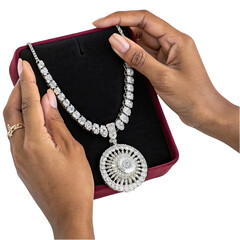 Delicate hands hold an elegant diamond necklace highlighting its intricate design and luxurious shine perfect for a special occasion or celebration