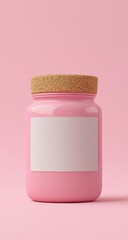 Pink jar with cork lid and blank label on a pink background