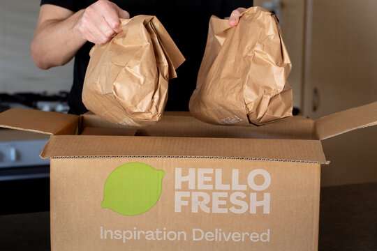 Sydney, Australia 2025-04-19 HelloFresh box containing meal kits placed on a kitchen counter. Subscription meal kit delivery service.