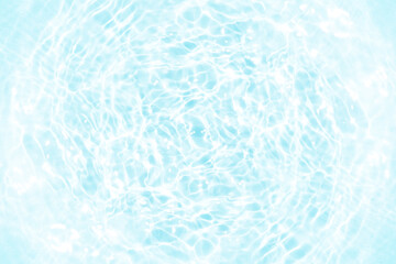 Blue water with ripples on the surface. Defocus blurred transparent blue colored clear calm water surface texture with splashes and bubbles. Water waves with shining pattern texture background.