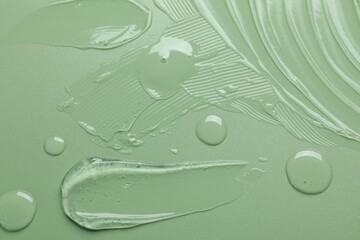 Collagen gel on green background, top view