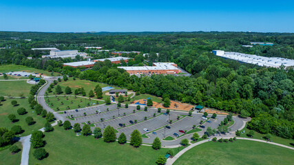 Aerial shot of a gorgeous landscape at Etowah River Park with lush green trees and grass in Canton Georgia USA