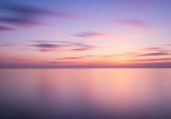 Obraz premium Photo of Beautiful Sunset Over Calm Ocean with Pink and Purple Hues