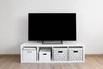 Lcd tv on white shef at modern room interior