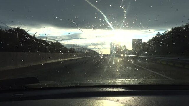 Washington DC USA A car drives into the sunset on Rte 66.