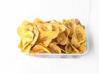 Banana chips sprinkled with white background isolation, banana chips made from musa paradisiaca bananas