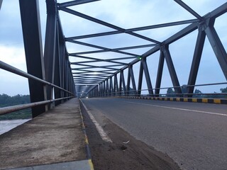 BIG BRIDGE OVER THE RIVER ON A BEAUTIFUL BRIGHT MORNING