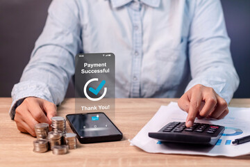 A woman making payment for online shopping using a mobile phone. Online payment concept.