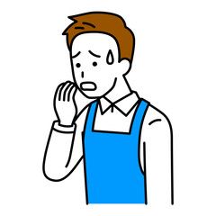 動揺しているエプロン姿の男性