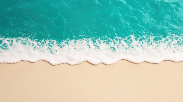 Tranquil turquoise water meets pristine sand on a clear day, creating a minimalist beach scene ideal for backgrounds