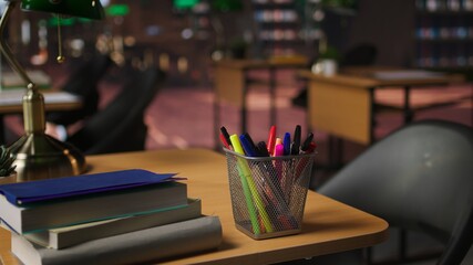 Empty academic setting combines historical charm with elegant study desks, serene lighting and a formal workspace. Vintage space offering a peaceful and inspiring atmosphere for research.