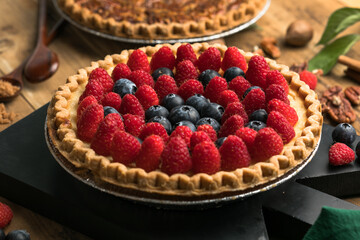 Fresh berry cake homemade traditional gourmet sweet dessert bakery food decorated with berries on rustic background table