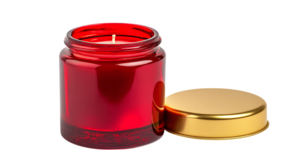 Holiday-themed candle in red glass jar with golden lid placed upright isolates on white background.