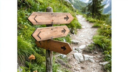 Wooden directional signs on a hiking trail in a lush mountain landscape.  Three signs point in different directions