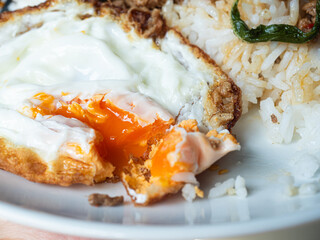close up cut egg yolk of sunny side up