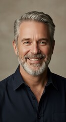 Obraz premium Photo Portrait of Smiling Middle Aged Man with Gray Hair against Beige Background
