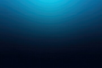 Obraz premium A deep blue gradient fades from light at the top to dark at the bottom, resembling an underwater or oceanic scene.