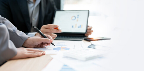 Cropped shot of diverse coworkers working together in boardroom, brainstorming, discussing and analyzing business strategy.