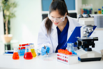 Discover a dedicated scientist conducting laboratory research, using pipettes, microscopes, and lab...