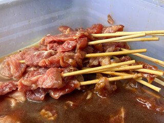 fried pork with sauce in the market