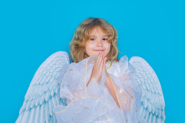 Angel prayer. Valentine angel. Little cupid child with prayer hands, hope and pray concept. Kid...