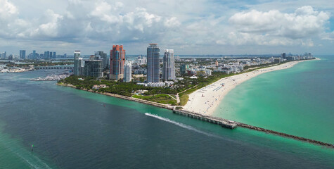 Aerial view of Miami Beach skyline. Drone shot of Miami Beach cityscape. Top view of South Miami Beach and the ocean. Miami Beach skyline with skyscrapers and coastline from above.