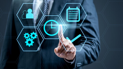 Businessman touches the icon of the clock on the productivity scheme. Technology innovation on the virtual screen. Concept of plan and time management