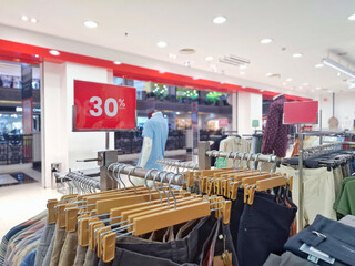 Clothing Store Sale Display with 30% Off Sign