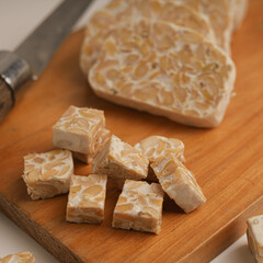 Raw tempeh on white background