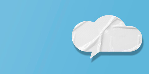 White speech bubble crumpled paper isolated on light blue background