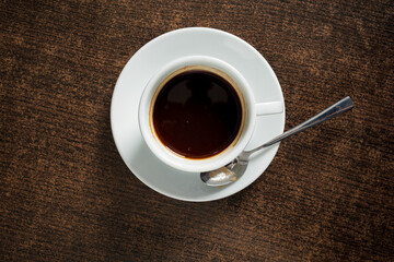 A steaming cup of dark coffee awaits, inviting peace and reflection