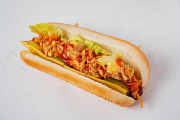 A flavorful hot dog loaded with lettuce, pickles, and sauces, ready to be enjoyed at any gathering