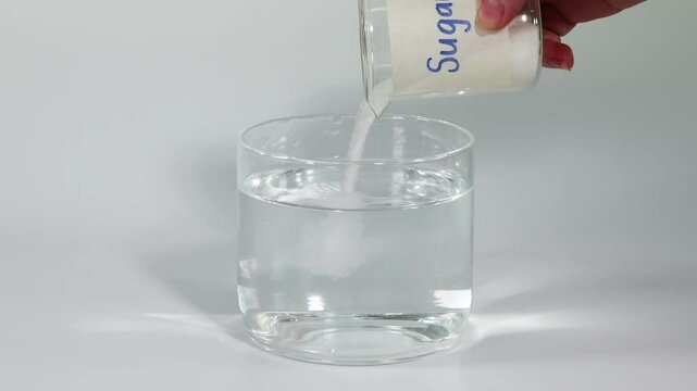 Sugar Stirring Process in Clear Glass Container