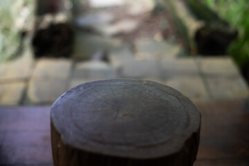 Empty wooden surface with vintage Javanese blur background, ideal for showcasing traditional products with a serene, classic atmosphere