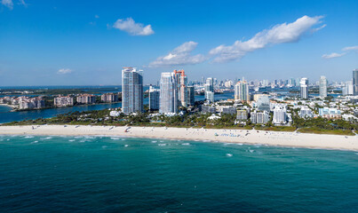 Obraz premium Miami beach cityscape. Miami summer aerial view. Miami Beach shoreline. South Beach Miami aerial view. Blue ocean in Florida skyline. Miamis cityscape.