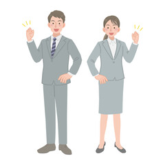 ガッツポーズをする会社員の男女