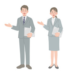 ノートパソコンを持って立つ会社員の男女