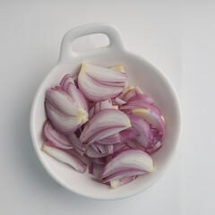 Shallot in a plate on white background