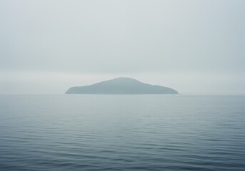 Photo Island in Mist with Grey Water and Sky Landscape View