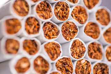 Burning cigarette with smoke and concept of cigarettes 