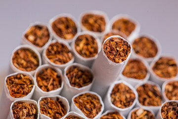 Burning cigarette with smoke and concept of cigarettes 