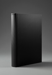 Photo of a Black Book on a Dark Grey Background With Textured Cover