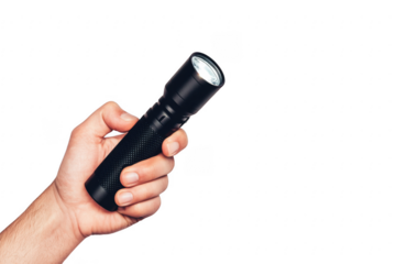 Hand holding a black led flashlight against a black background