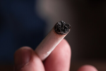 Burning cigarette with smoke and concept of cigarettes 