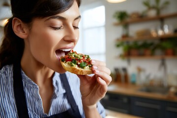 Woman savoring a delicious open-faced sandwich in a kitchen
