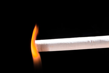 Burning cigarette with smoke and concept of cigarettes 