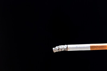 Burning cigarette with smoke and concept of cigarettes 