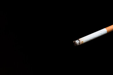 Burning cigarette with smoke and concept of cigarettes 