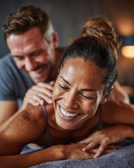 Couple enjoying a spa experience with smiles and relaxation.
