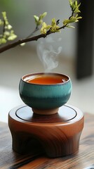 Steaming teacup on wooden coaster
